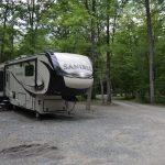 Peaceful campsite at Canyon Country Campground in Wellsboro PA surrounded by trees