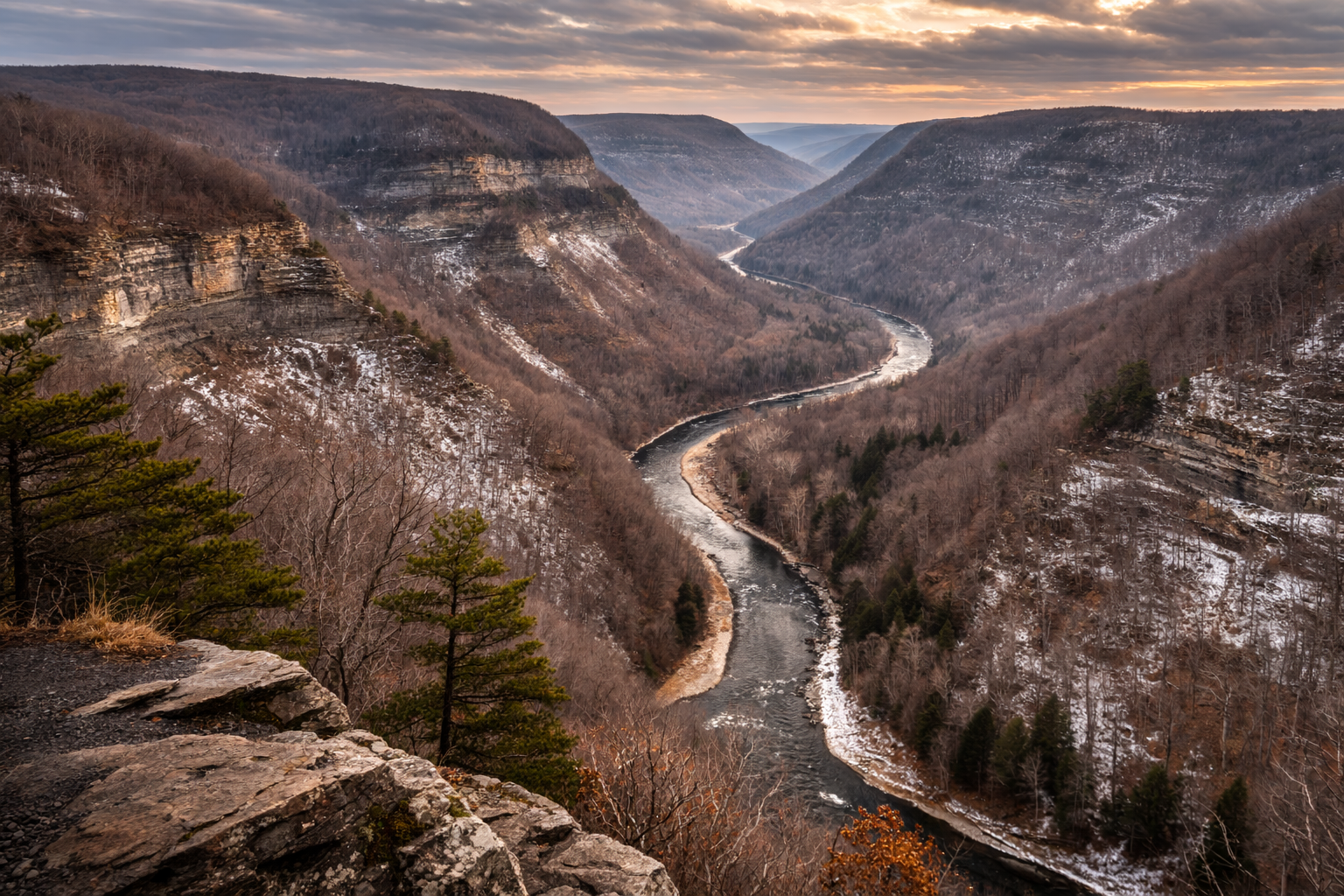 Scenic view of Pine Creek Gorge with layered ridges and winding creek showing the landscape of the Pennsylvania Grand Canyon